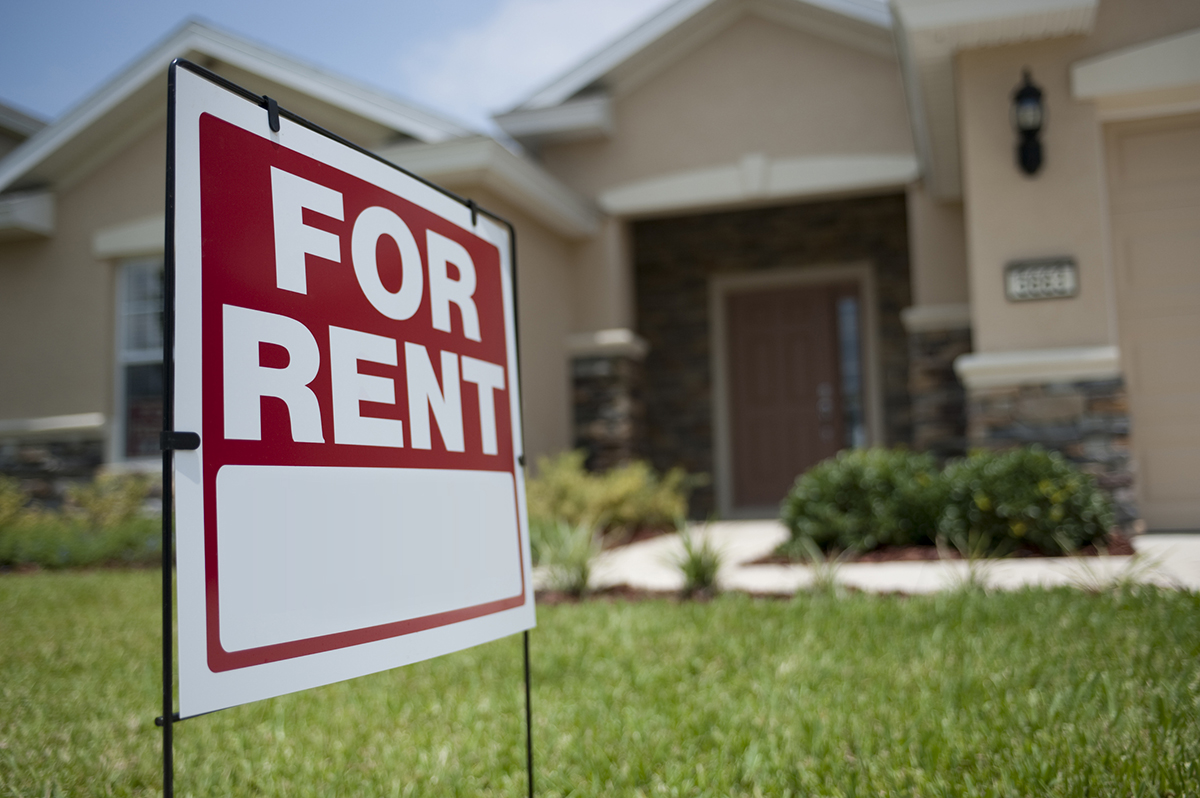 For Rent sign in front of a residential home, highlighting rental market dynamics in Arizona.