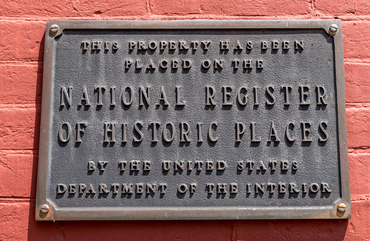 Plaque displaying National Register of Historic Places designation for a historic property